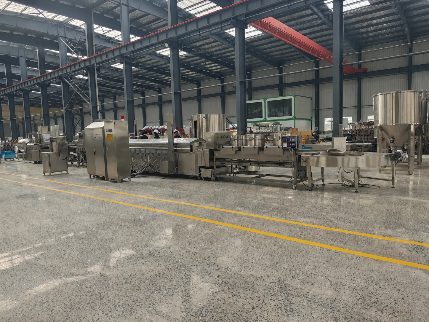 Connected coating and frying equipment photographed in the Hadof workshop